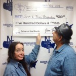 Terri and Jose Hernandez display their bonus check.