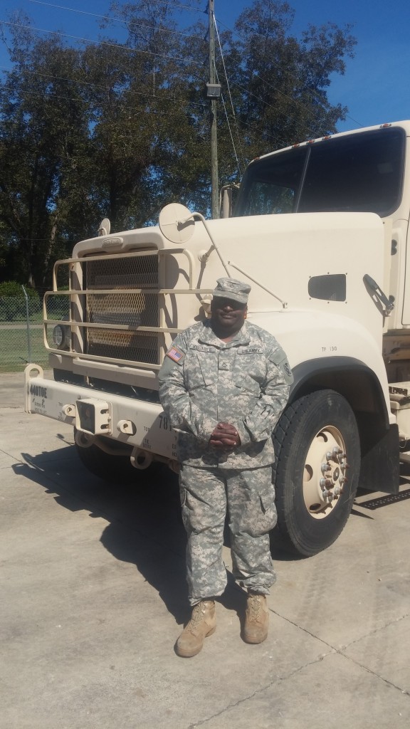 Darrel poses with his military issued Freightliner 915-A5 truck